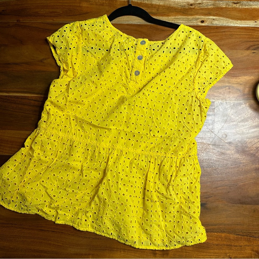 Yellow cutout peplum shirt